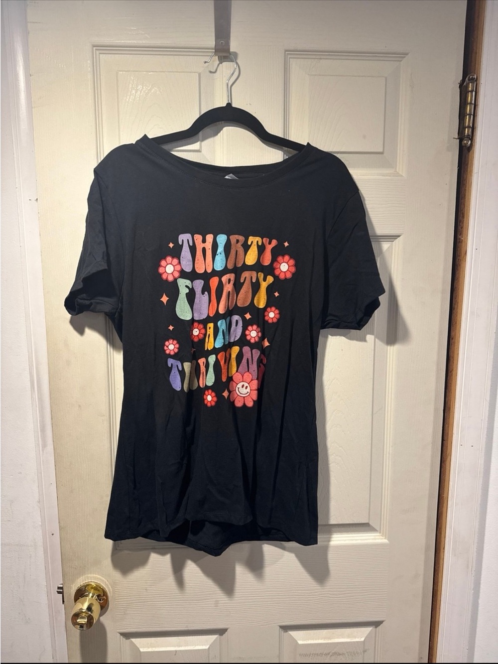Port and Company Black Tee with Colorful Retro Flower Graphic
